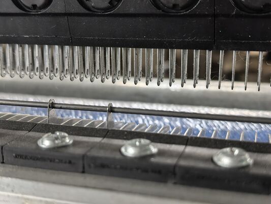 Compreender o papel das barras-guia nas máquinas de malha